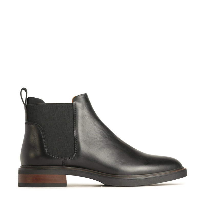 EOS Blaiz black boots shown from outside view, featuring stylish design and sleek black leather for casual or dressy wear.