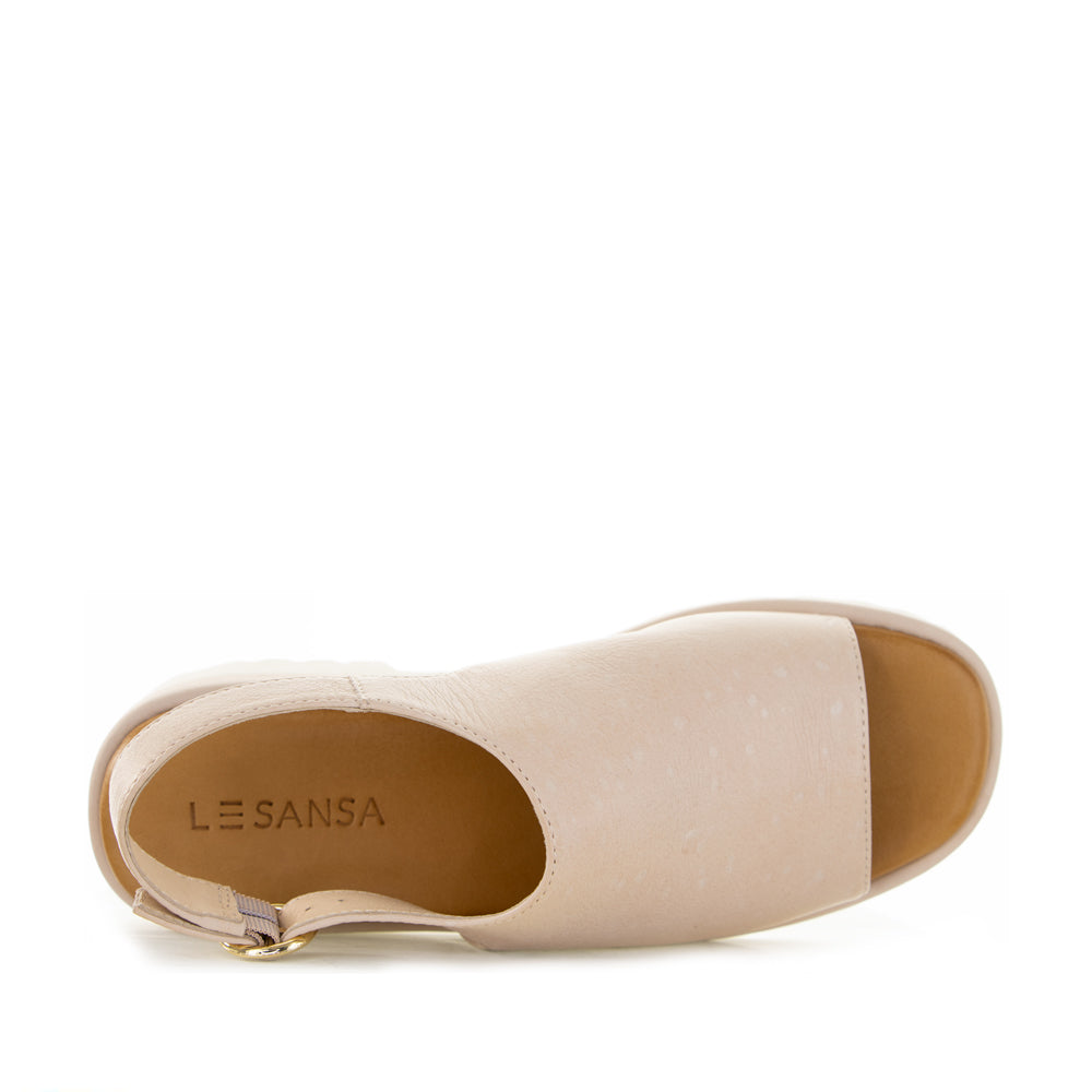 Le Sansa Briar Blush sandals with ankle straps and open toe design, showcasing soft blush pink leather and stylish craftsmanship.