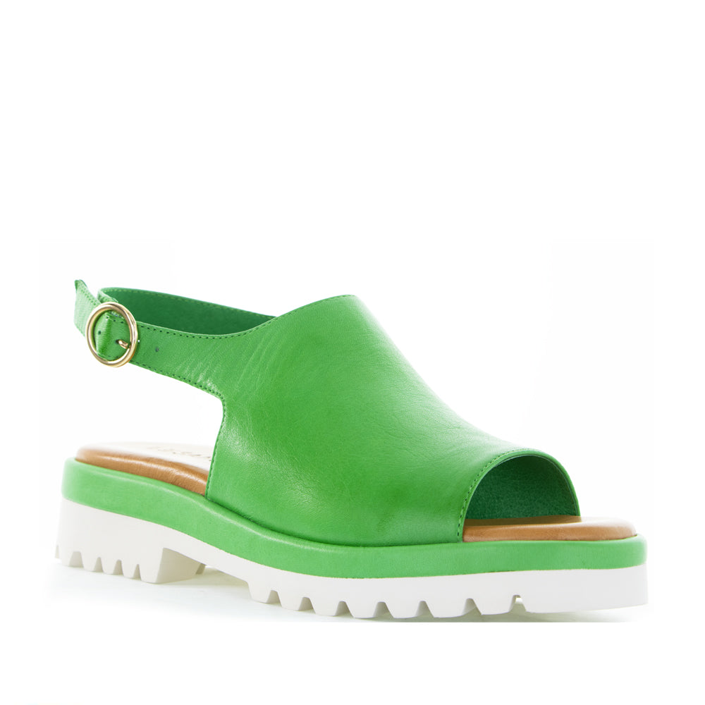 Le Sansa Briar Fern Green sandals featuring open-toe design, ankle straps, and woven detailing on a white background.