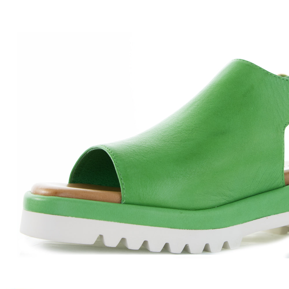 Le Sansa Briar Fern Green sandals with open toes and ankle straps, featuring a comfortable, stylish design in vibrant green.