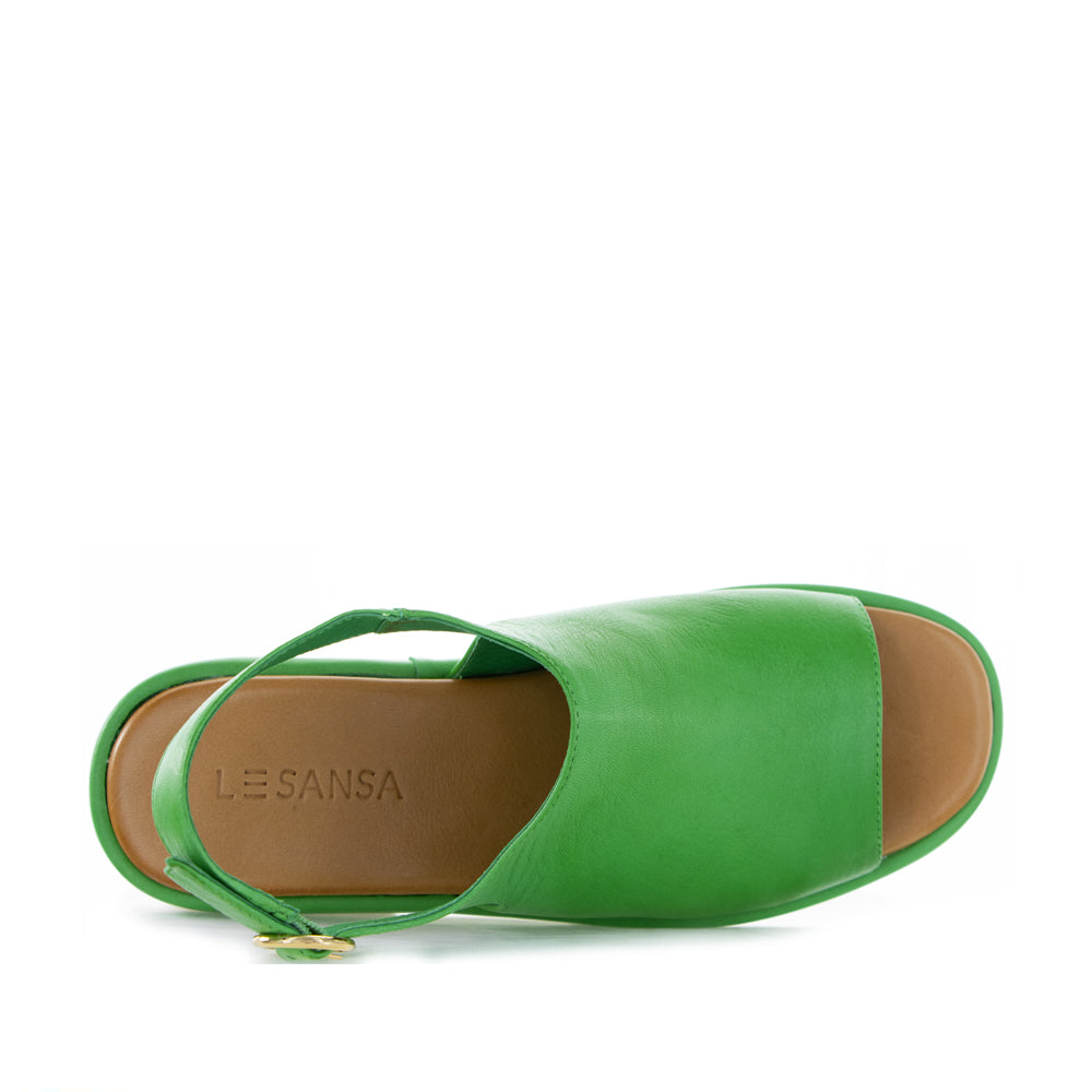 Le Sansa Briar Fern Green sandals with open toe design and crisscross straps on a neutral background.