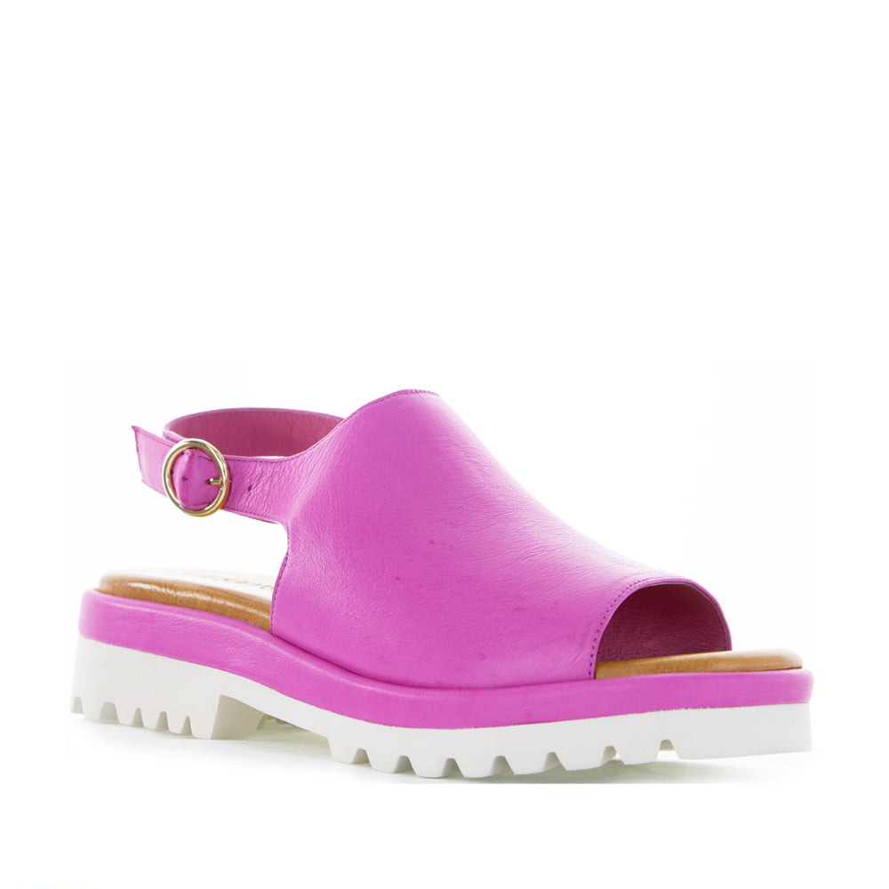 Pink leather sandals by Le Sansa, model Briar, featuring a stylish open-toe design and ankle strap detail.