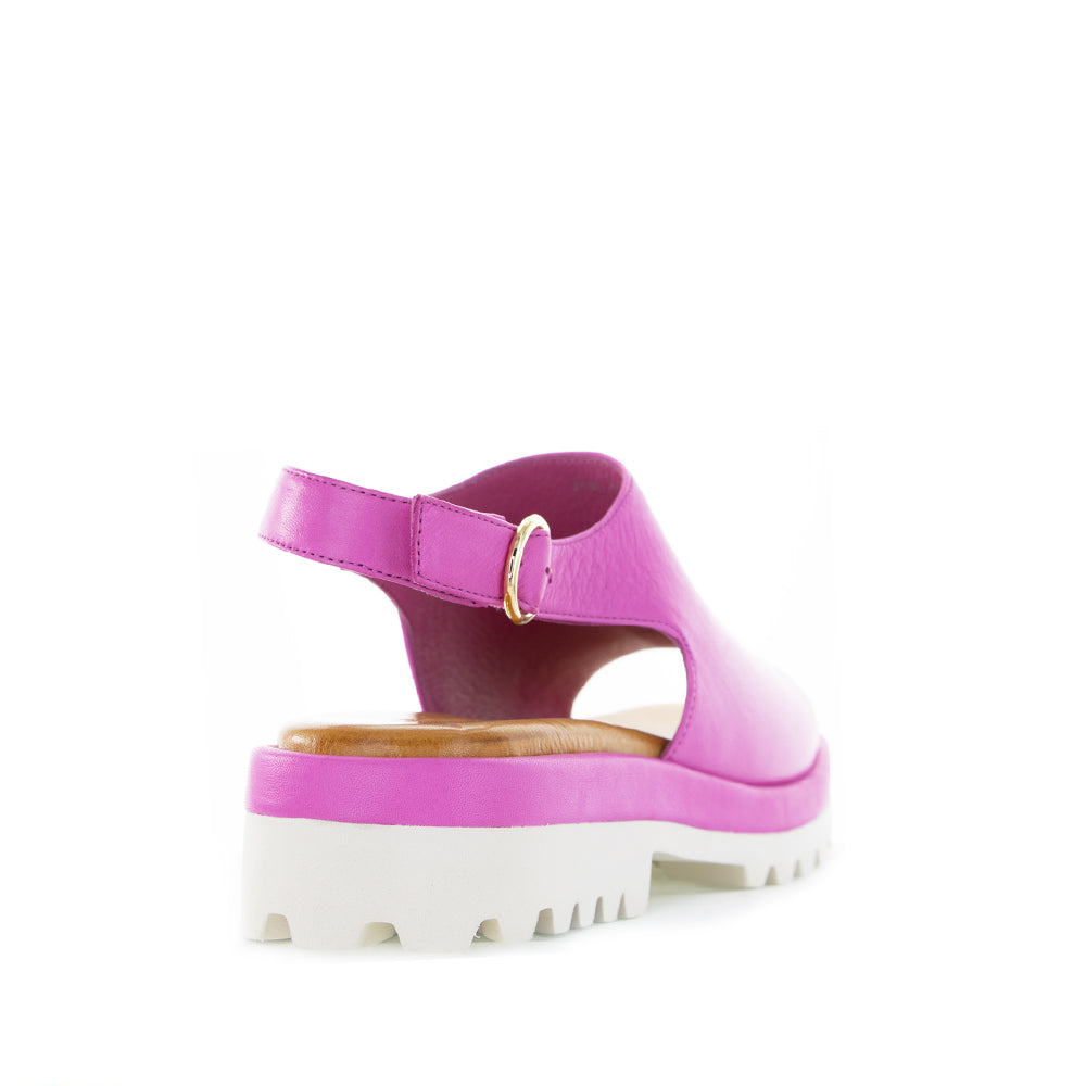 Le Sansa Briar hot pink sandals with open toes and ankle straps, stylish footwear for casual or summer wear.