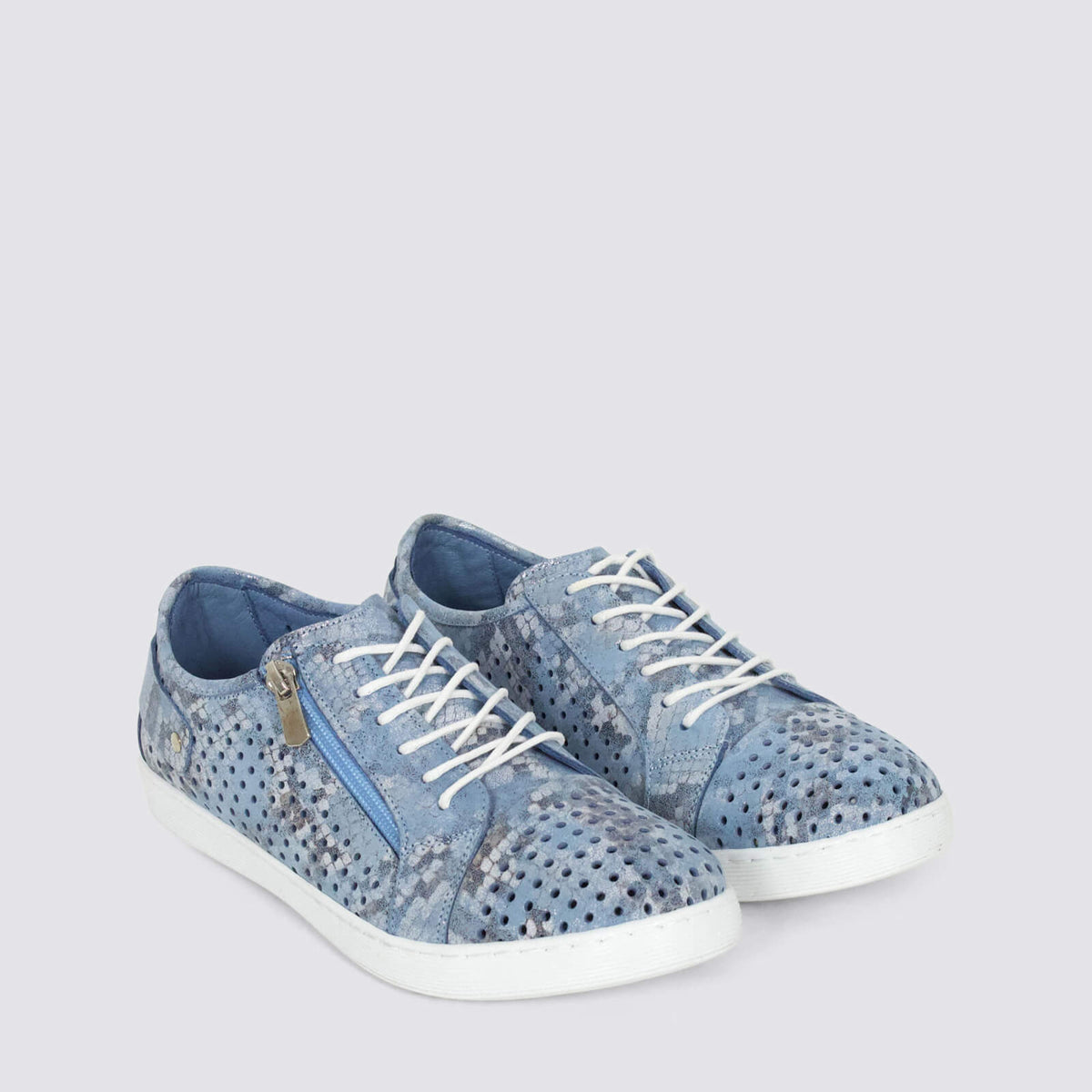 Pair of Cabello CABELLO EG17 denim sneakers with white soles and blue denim fabric, displayed on a white background.