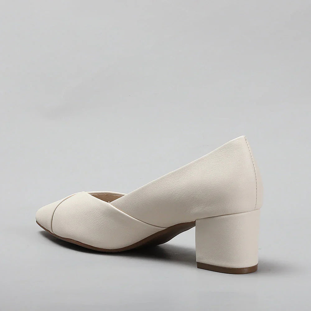 Le Sansa Carly Nude heels with sleek design and pointed toes, displayed on a neutral background.