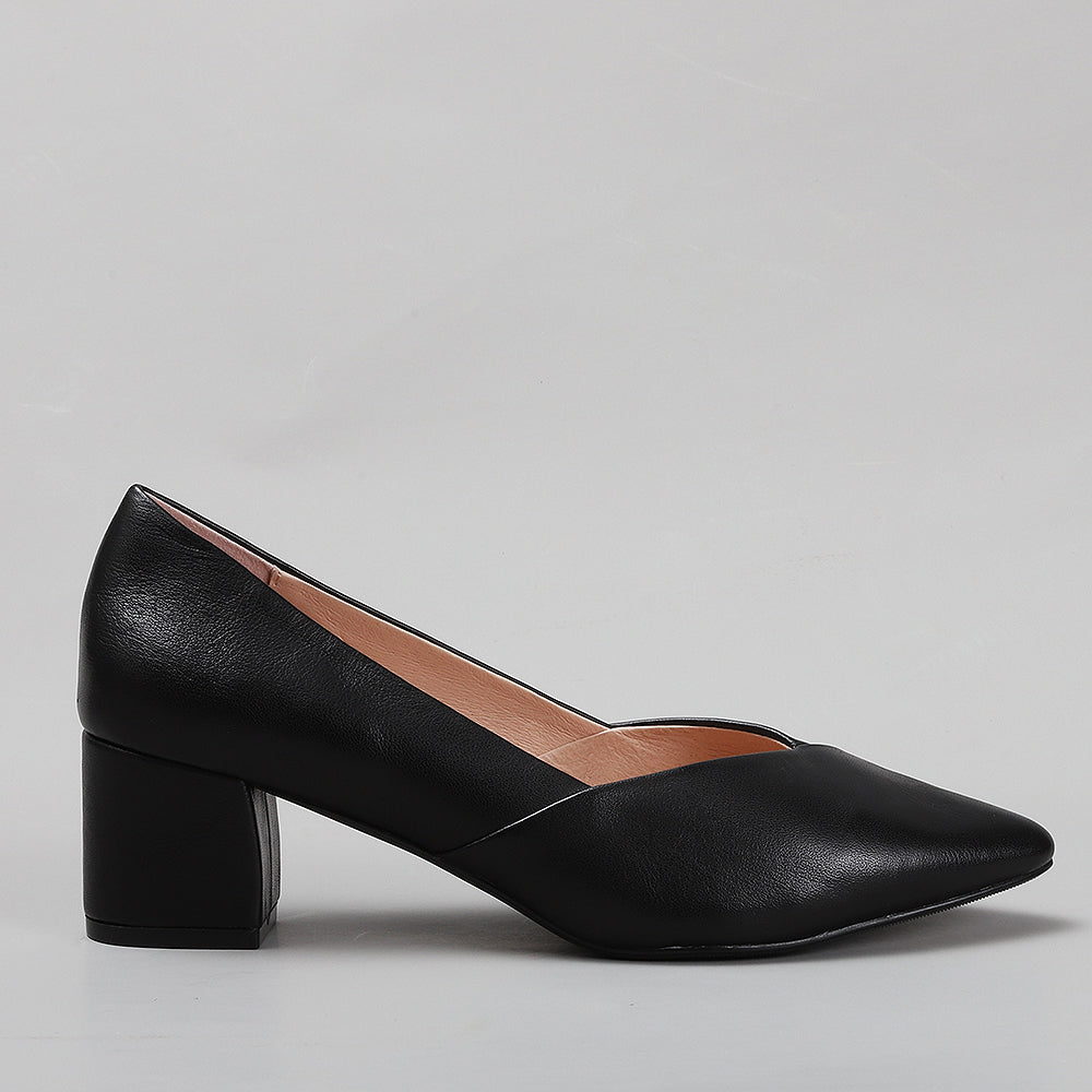Le Sansa Carly black heels shown from the side, featuring sleek design and pointed toe, perfect for stylish footwear.