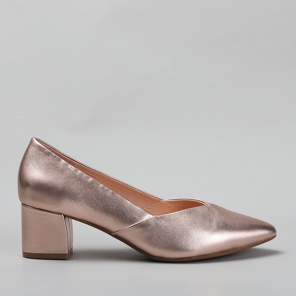 Le Sansa Carly Rose Gold heels shown from the side, featuring elegant design and metallic rose gold finish.