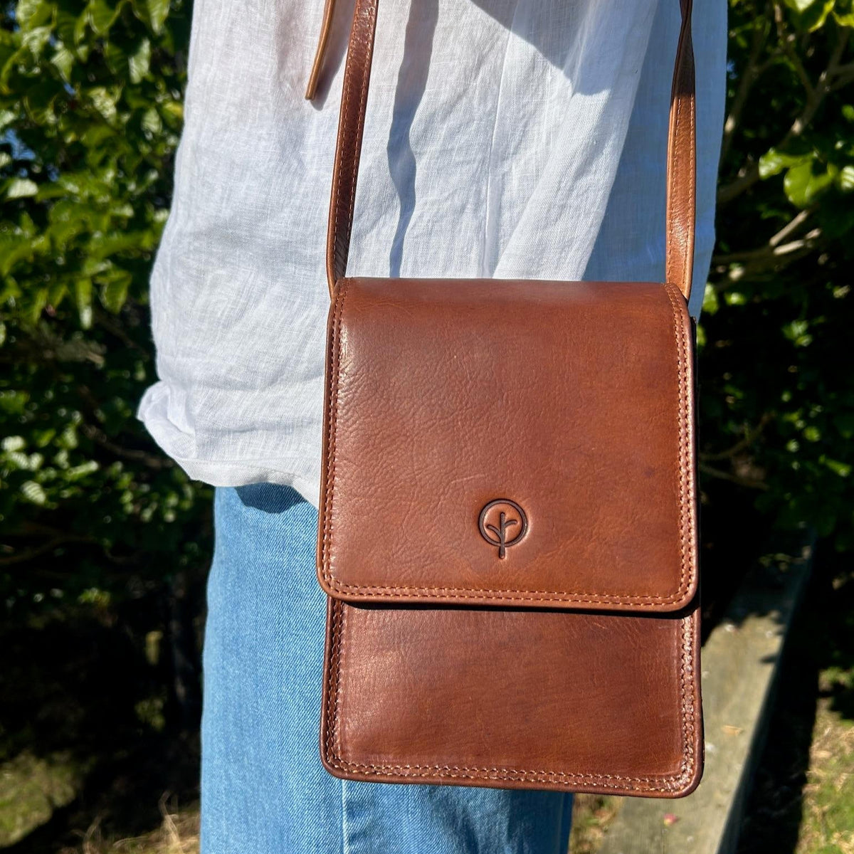 Second Nature CB6 Tan handbag with sleek design, featuring a smooth tan leather finish and stylish handle.