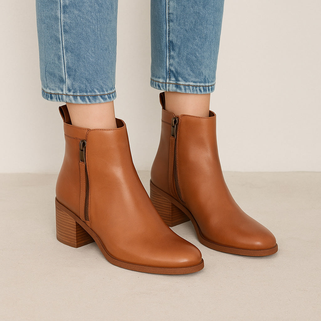 Eos Ciara Brandy boots featuring tan leather upper, round toe, ankle-height design, and stylish stitching details.
