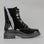 Black patent leather boots from LE SANSA, stylish side view of the LESANSA COOLIE boot with sleek shiny finish.