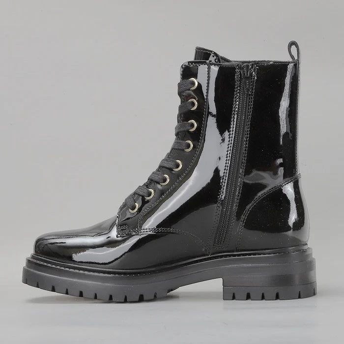 Black patent leather boots from LE SANSA, featuring a sleek design and stylish silhouette, ideal for fashion-forward outfits.