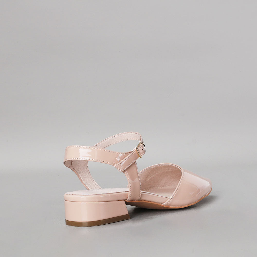 Le Sansa Coralie Nude Patent sandals with open-toe design and ankle strap, stylish footwear for warm weather.