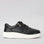 Le Sansa Cosco Black sneakers shown from the side, featuring a sleek black design and casual athletic style.