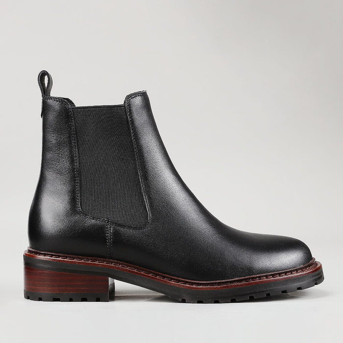 Le Sansa Costa Black boots shown from side, featuring sleek black leather design and stylish ankle height.