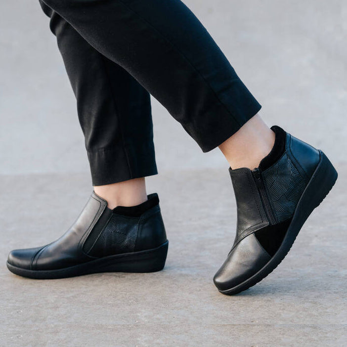Black Cabello CP462-18 boots with sleek design and ankle-high style, featuring a sturdy sole and modern look.