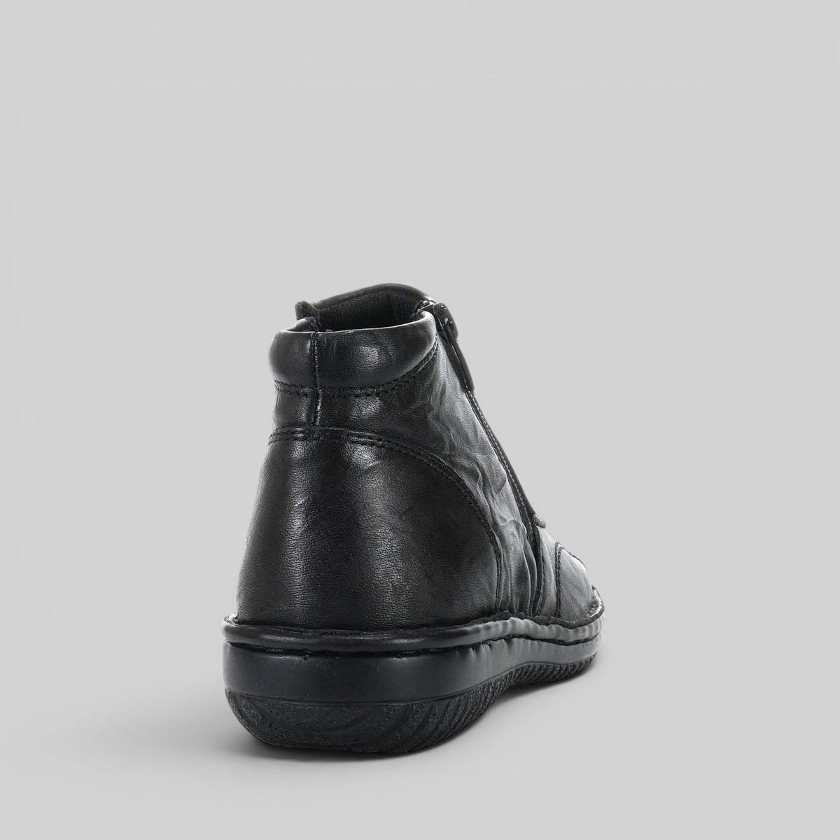 Black crinkle ankle boots by Cabello, featuring a stylish textured finish and classic ankle height, perfect for everyday wear.