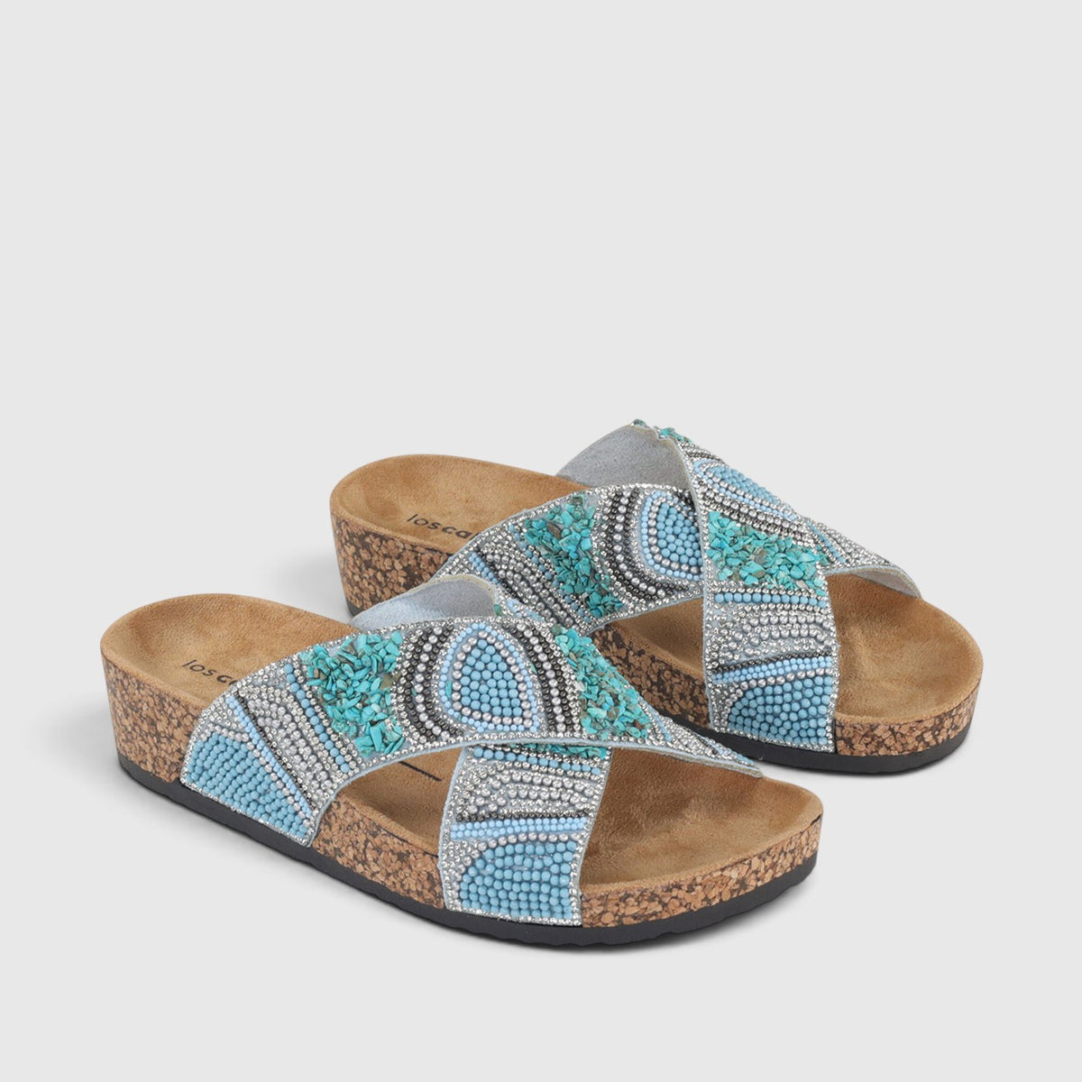 Blue Los Cabos Capri slippers shown from a top view, featuring soft fabric and casual slip-on style.