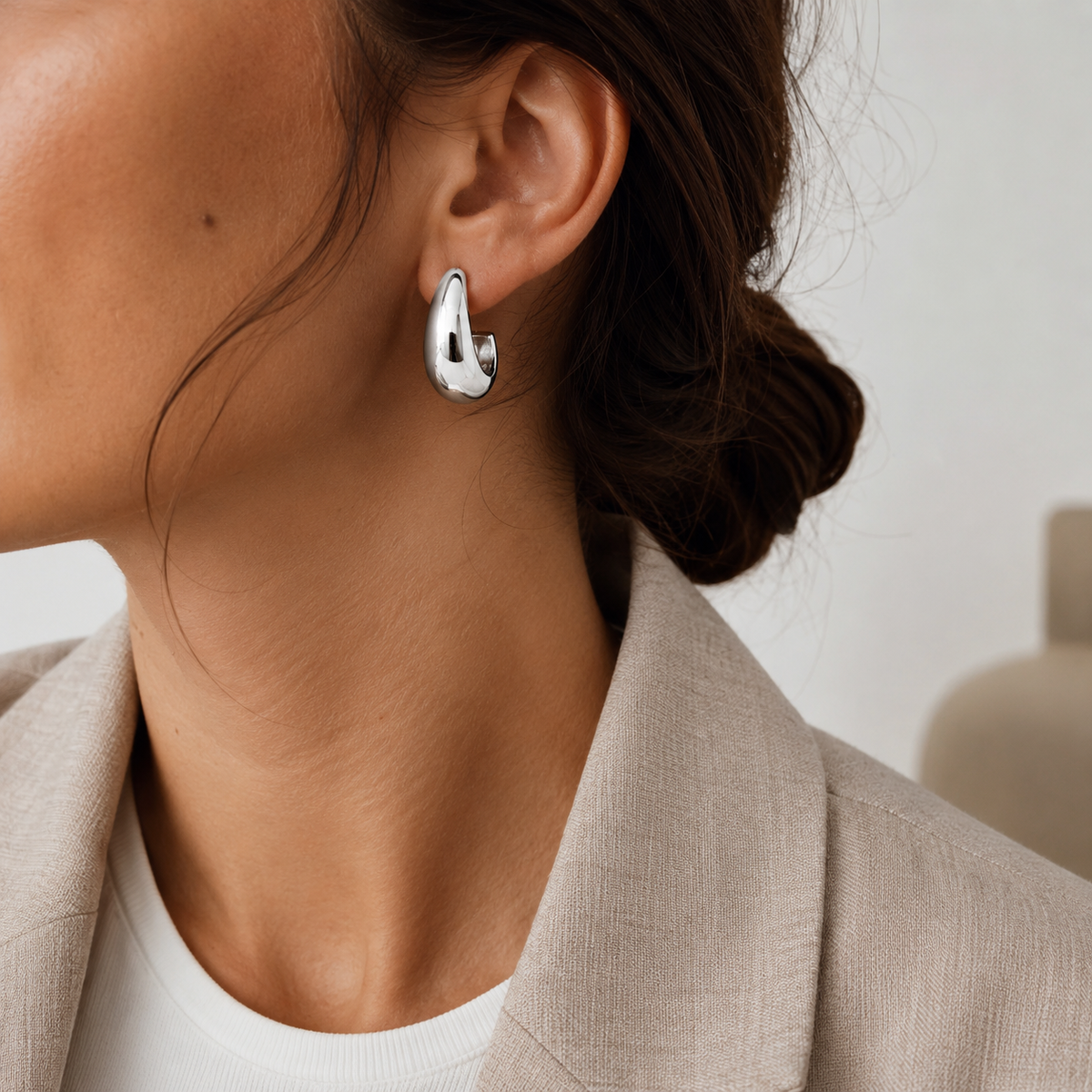 Silver soft steel earring by A & C Oslo featuring a sleek, minimalist design with a polished finish.