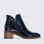 Naked Arches Oxley Navy Patent boots featuring sleek navy patent leather and stylish ankle-length design.