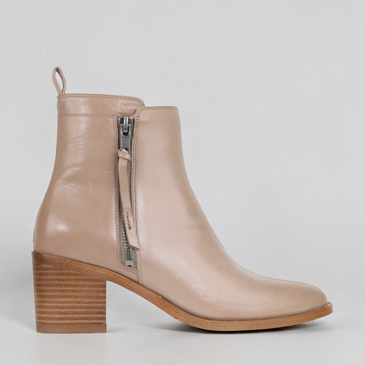 EOS Ciara taupe boots shown outdoors, featuring ankle-high design with textured material and stylish details.