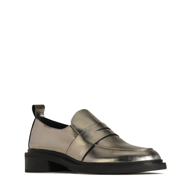 Eos Coia pewter metallic loafers showing a side angle with sleek design and polished finish.