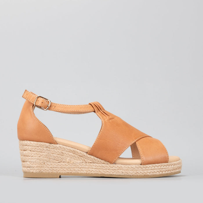 Le Sansa Pernia tan sandals featuring strappy design and flat soles, stylish and comfortable footwear for casual wear.