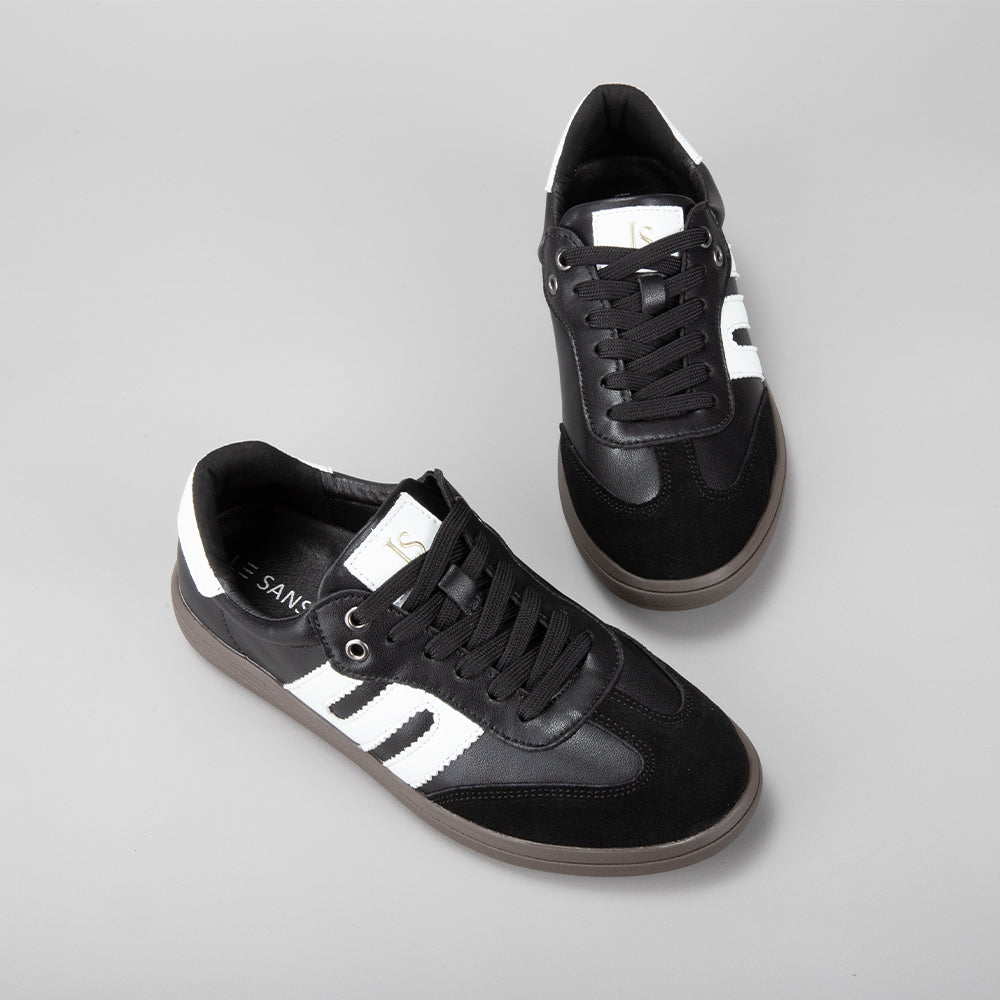 Le Sansa Juno black and white sneakers with stylish design, showcasing comfortable footwear for casual wear.
