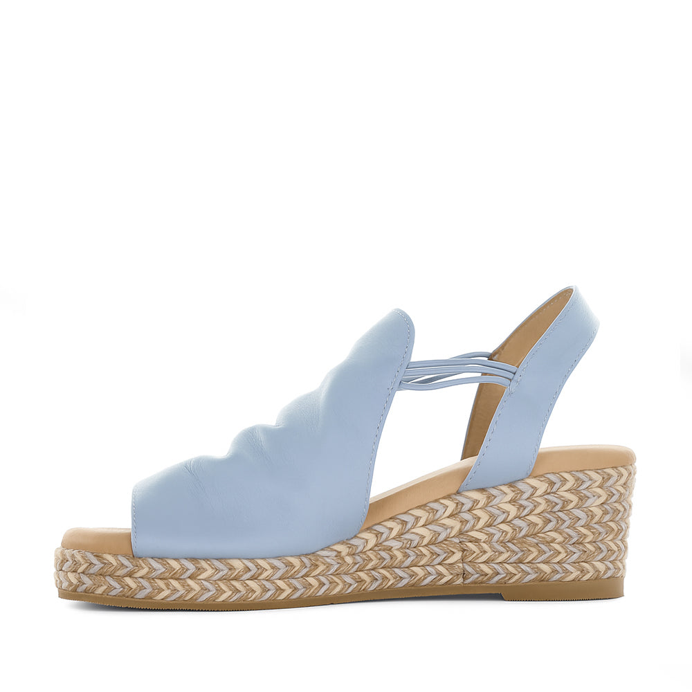Le Sansa Darla baby blue sandals with open toe design and ankle strap, perfect for casual summer wear.