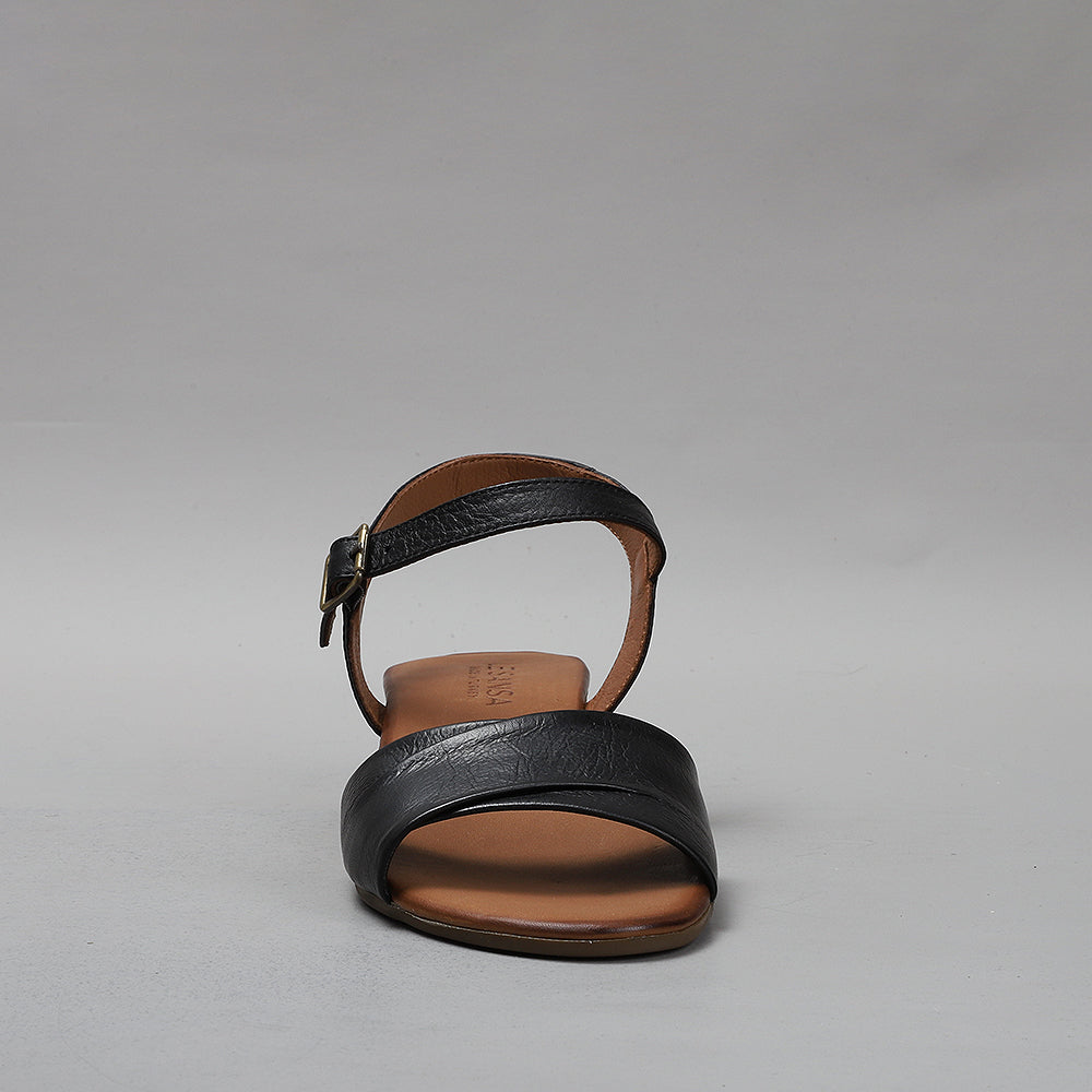 Le Sansa Delta Black sandals featuring sleek black straps and a comfortable flat sole, perfect for casual summer wear.