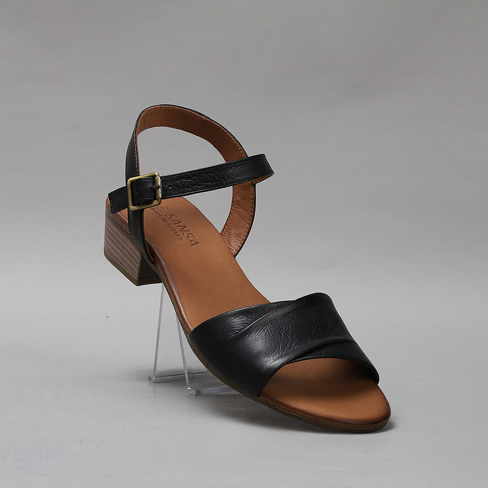 Black Le Sansa Delta sandals with open toes and ankle straps, featuring a sleek, modern design perfect for casual wear.