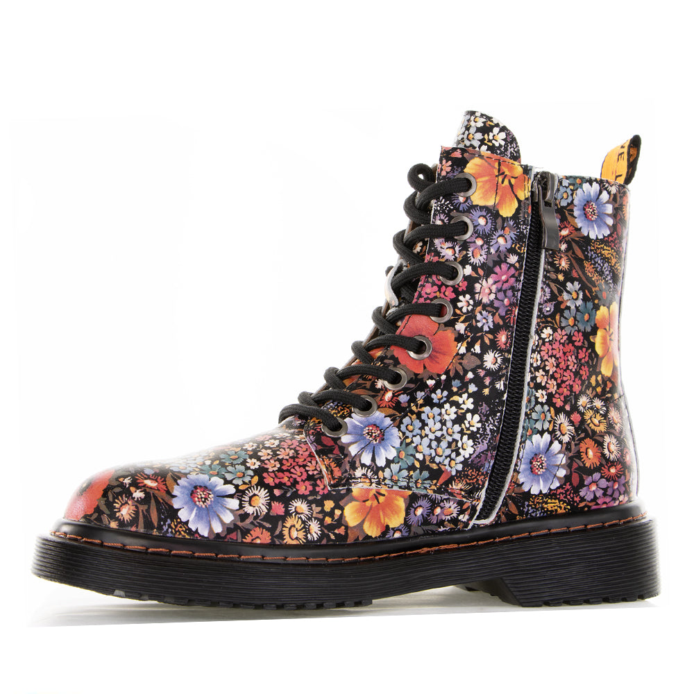 Black Le Sansa Depth boots with floral embellishments, showcasing stylish ankle-high footwear with a sleek design and textured finish.