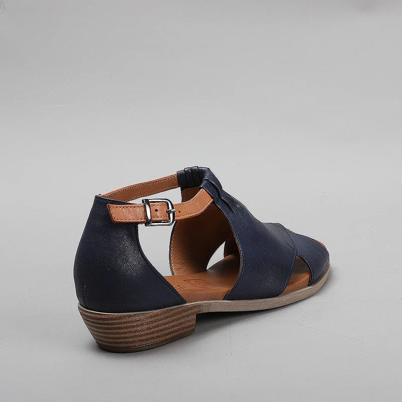 LE SANSA Digby navy and tan sandals with open toe design and ankle strap, stylishly displayed on a neutral background.