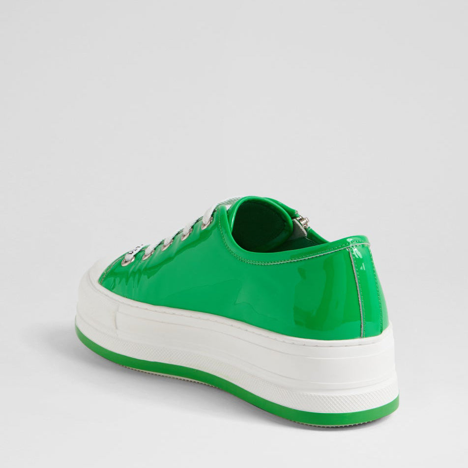 Django & Juliette Giza emerald patent sneakers with white soles and stylish design, featuring a shiny, glossy finish.