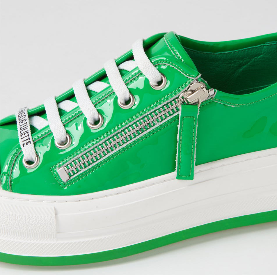Django & Juliette Giza emerald patent sneakers with white sole and sleek design, showcasing shiny emerald green finish.