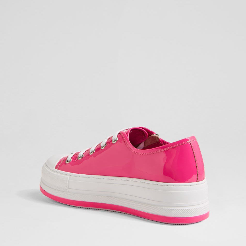 Django & Juliette Giza Candy Patent sneakers in pink with white soles and lace-up design, stylish footwear for casual wear.