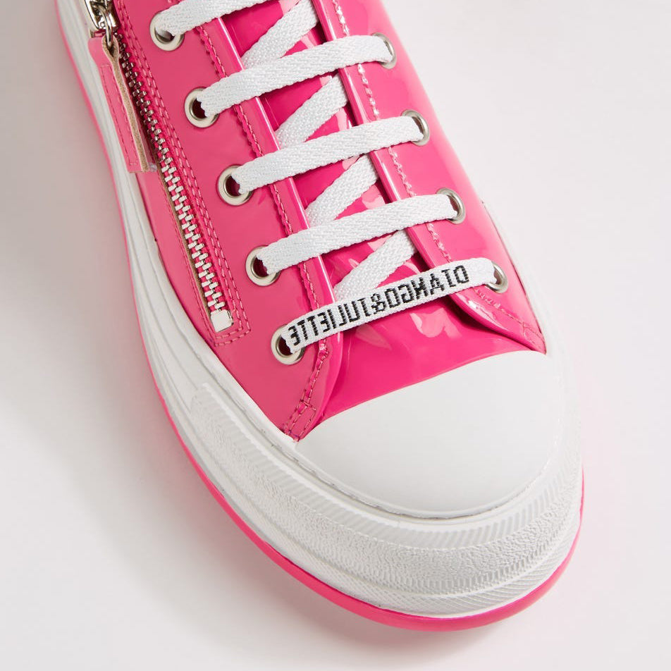 Django & Juliette Giza Candy Patent sneakers with shiny pink patent leather, rounded toe, and sporty lace-up design.