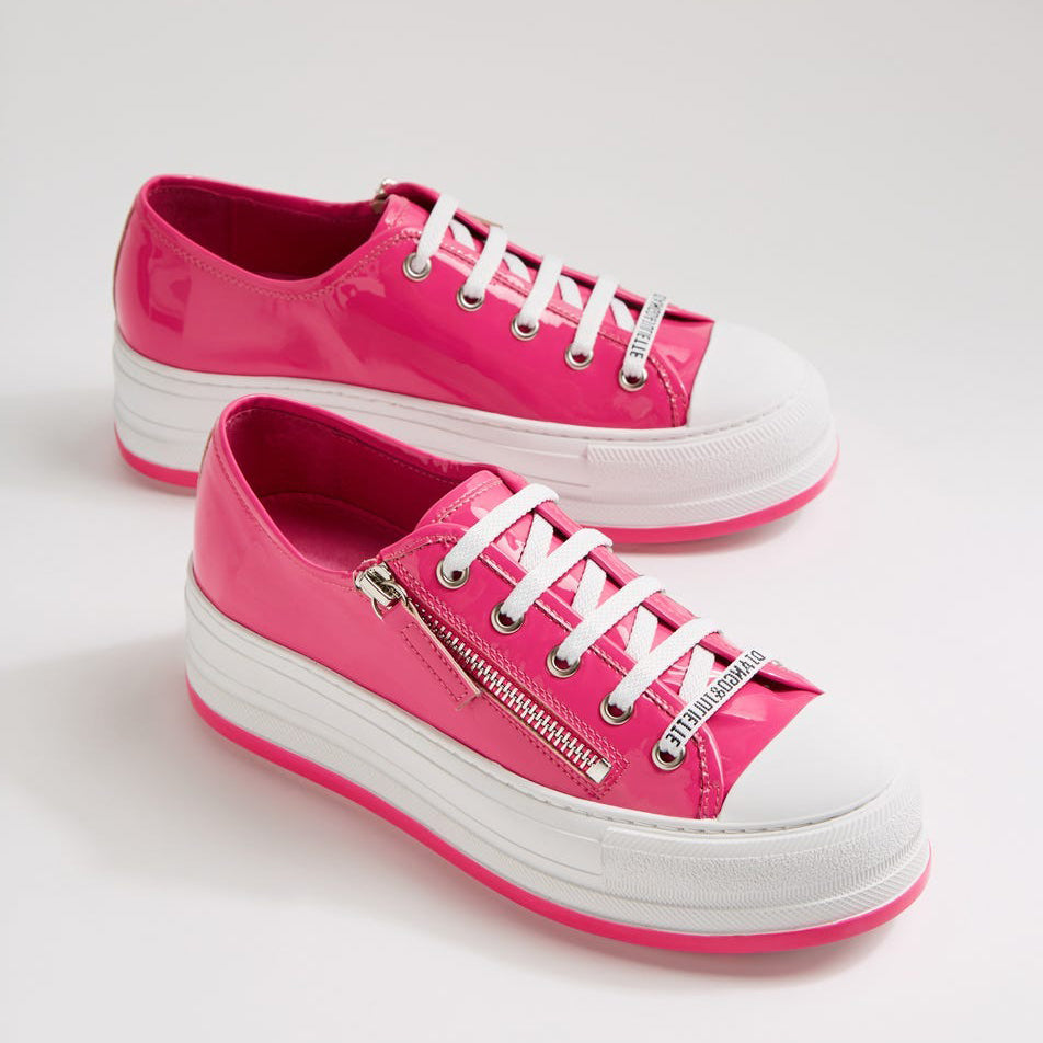 Django & Juliette Giza Candy Patent sneakers with shiny pink patent leather and white rubber soles, front view.