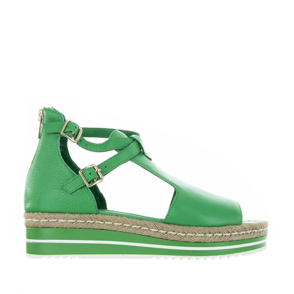 Django & Juliette Alexys emerald sandals with ankle straps and open toe design, displayed on a neutral background.