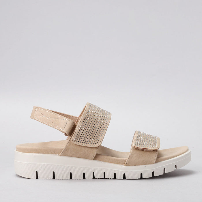 CC RESORTS Dominic beige sandals shown from the side, featuring a casual slip-on style and comfortable design.