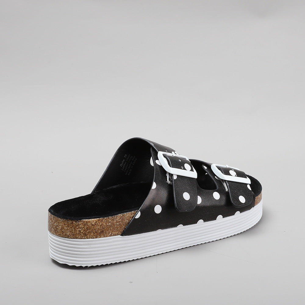 LE SANSA Duke black dot flats showing a sleek design with black fabric and stylish polka dot pattern, perfect for casual wear.