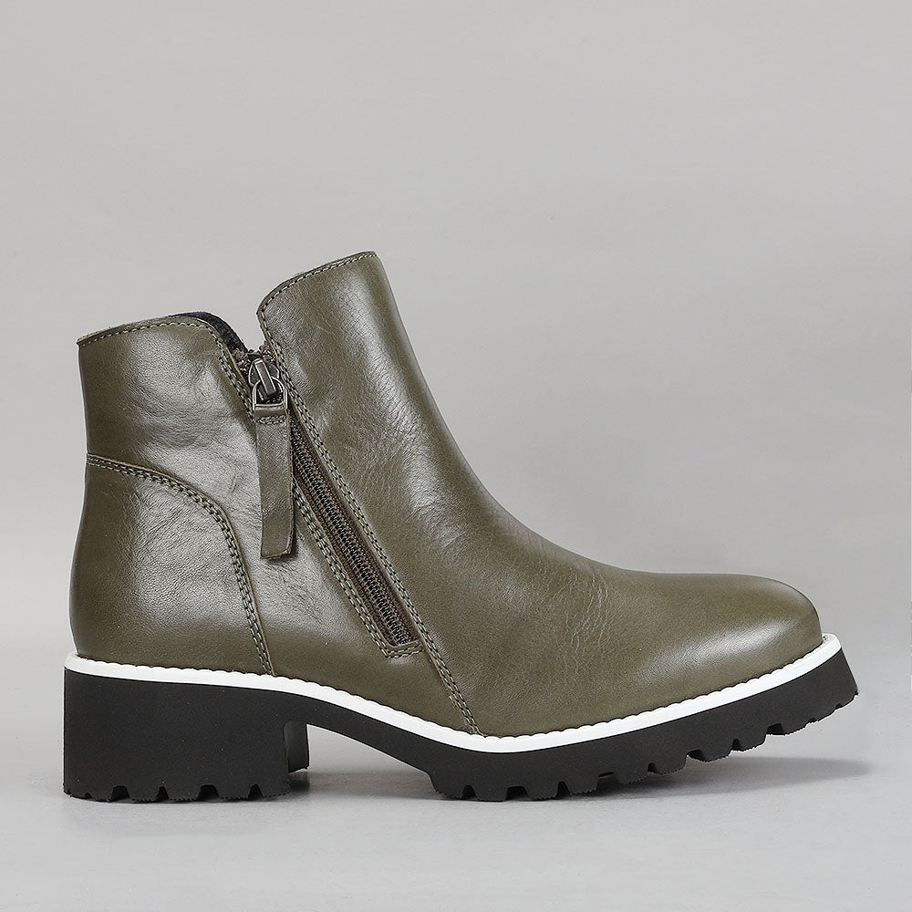 LE SANSA EAST OLIVE boots shown from the side, featuring a sleek design and olive color, crafted by LE SANSA.