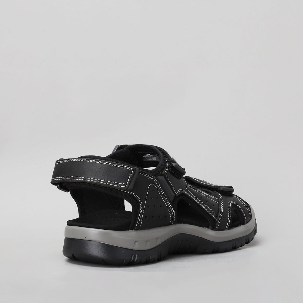 Black CC Resorts EKAM sandals with open toes and ankle straps, shown on a neutral background.