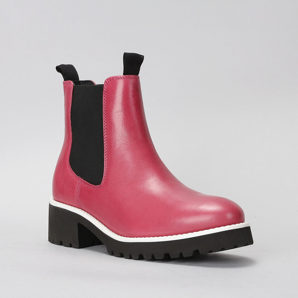 Le Sansa El Sansa Elby hot pink boots with sleek design and pointed toes, displayed against a neutral background.