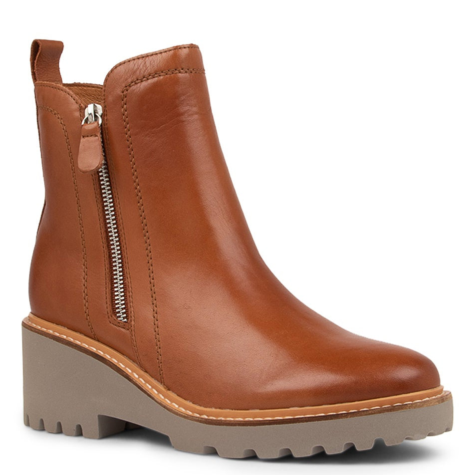 Eos Parson Brandy boots in tan leather with ankle-length design and stylish stitching, showcasing a sleek, modern look.