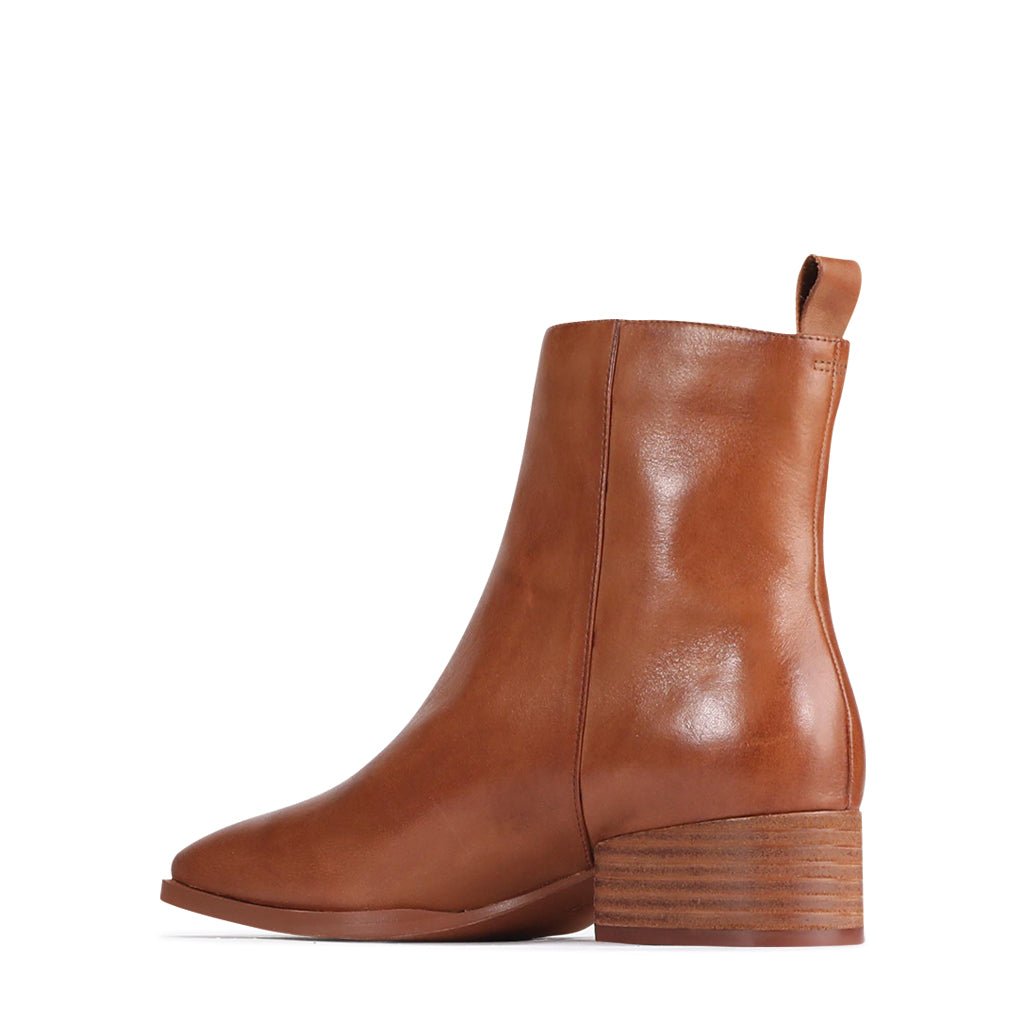 Pair of stylish EOS Kendra Brandry boots with ankle-high design, leather material, and decorative stitching.
