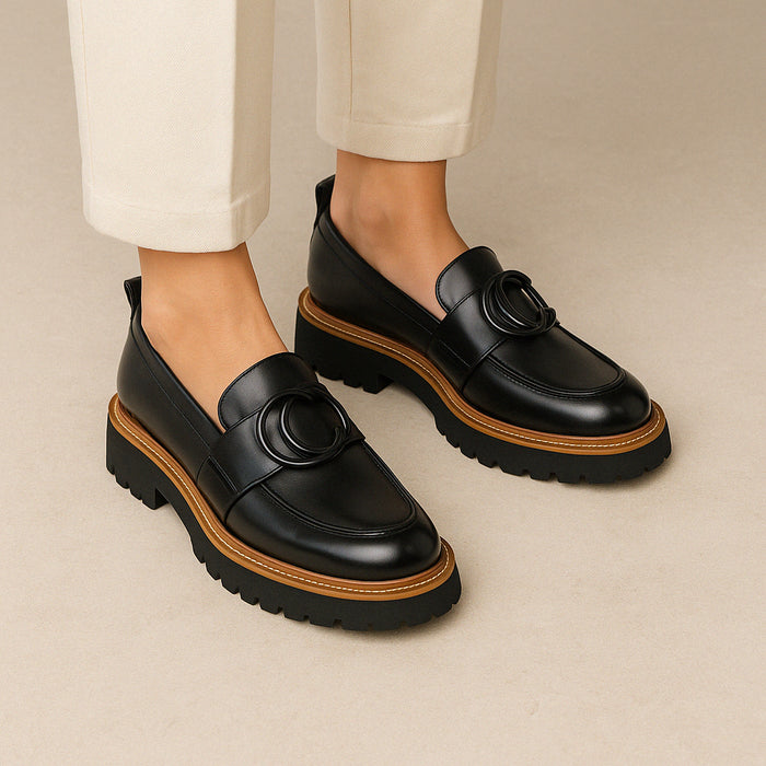 Eos Abbi black loafers shown from the back, stylish slip-on footwear with sleek design and low heel for casual or formal wear.