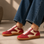 Red EOS Antigona sneakers with stylish design and white accents, featuring comfortable laces and a sleek athletic look.