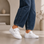 White EOS JOVI sneakers with sleek design, featuring white laces and a modern silhouette for casual and everyday wear.