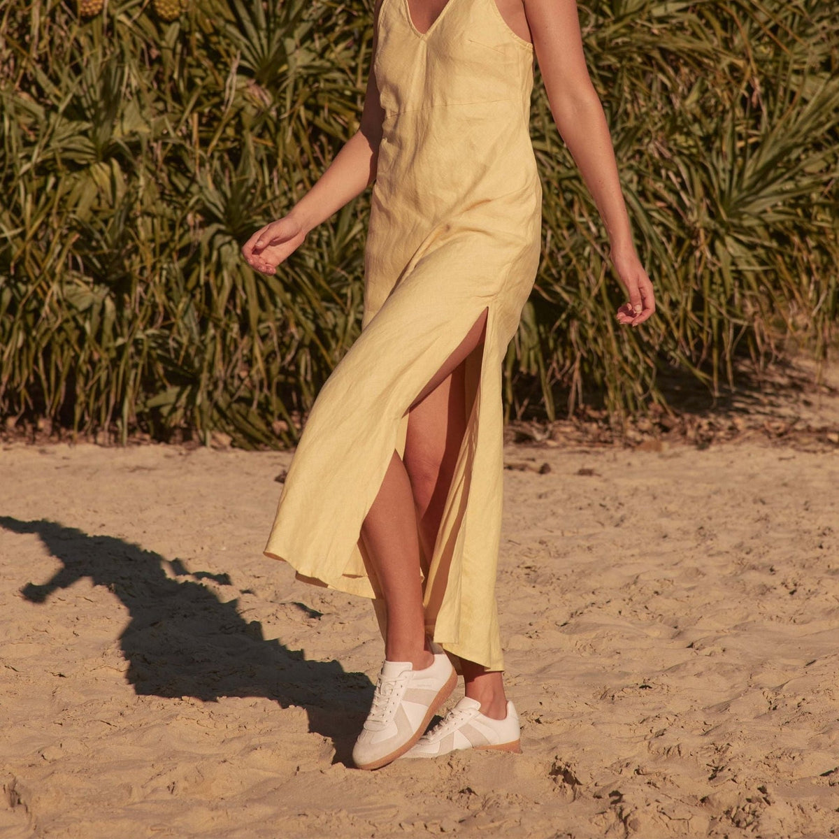 Eos Melbaa white sneakers with sleek design and white laces, showcasing comfortable casual footwear for everyday wear.