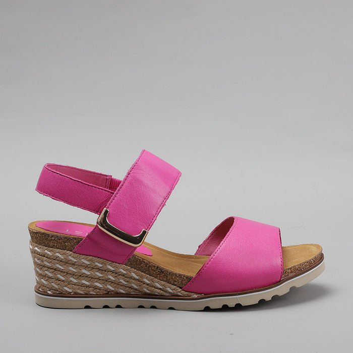 Le Sansa Evita Hot Pink sandals with side view showing vibrant pink straps and stylish design.
